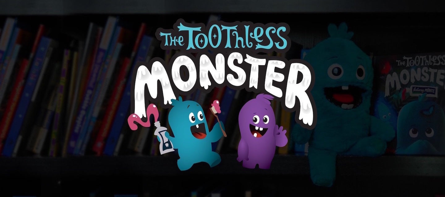 The Toothless Monster logo with blue and purple monsters. Friends of the tooth fairy.